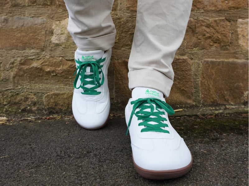 Naturcontact white barefoot sneakers with green accents and natural rubber soles for daily comfort.
