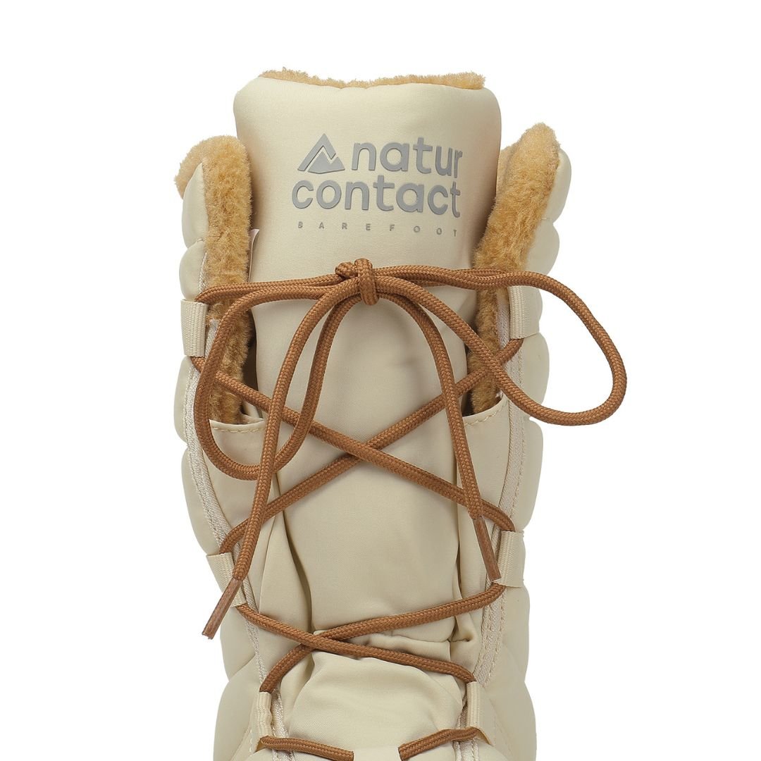 Detail of cream-colored Naturcontact women’s winter barefoot boots with laces and warm lining