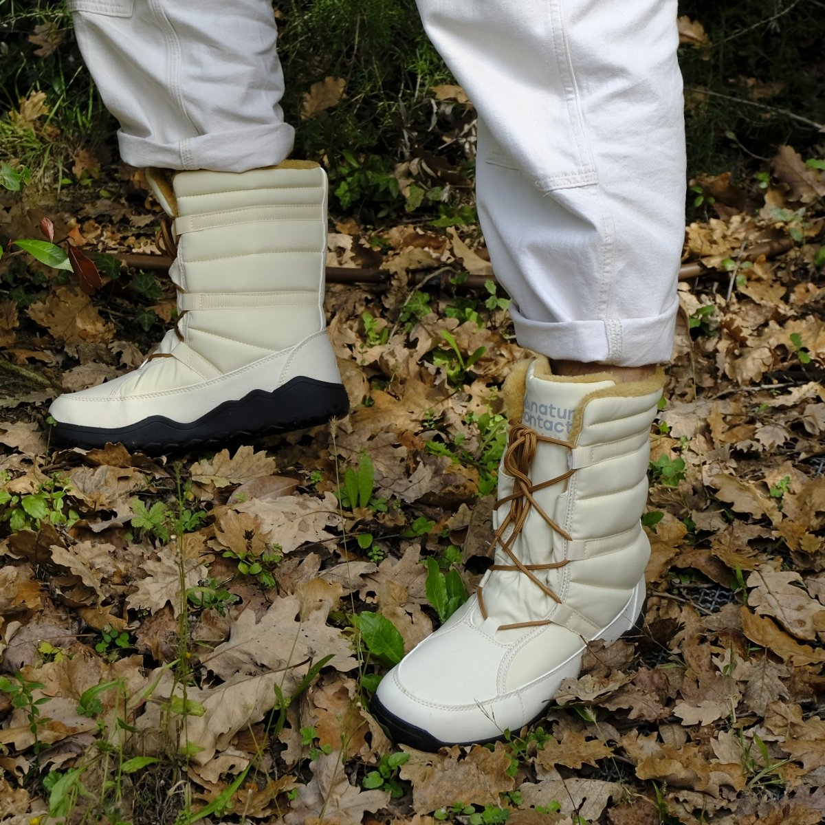 Naturcontact women’s winter barefoot boots worn outdoors on forest ground, showing flexibility and comfort in use