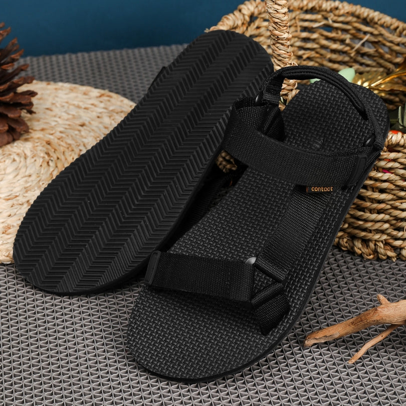 Naturwalkers 2.0 black barefoot sandals displayed in a lifestyle setting