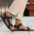 Naturwalkers 2.0 black barefoot sandals worn while walking outdoors