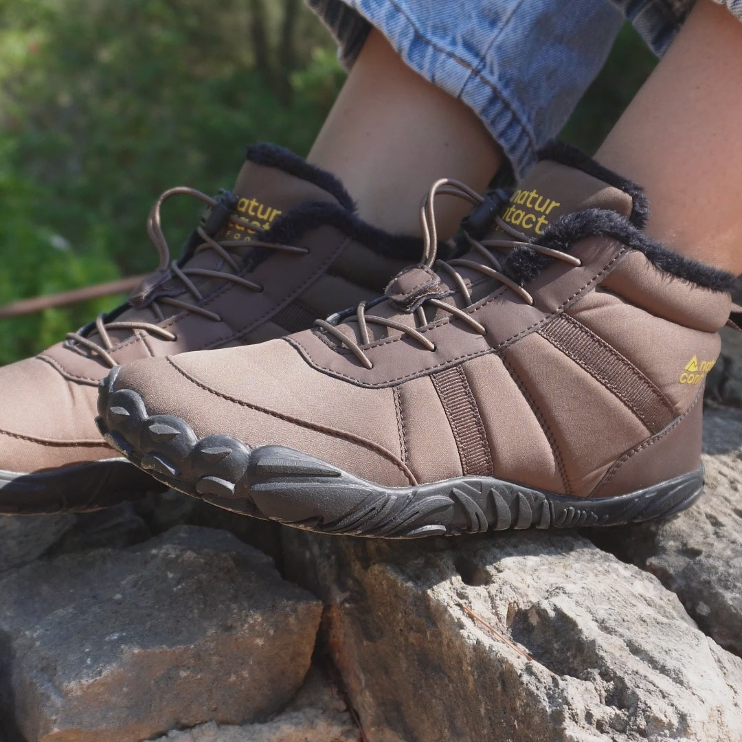 video brown barefoot shoes on the rocks and naturcontact yellow logo