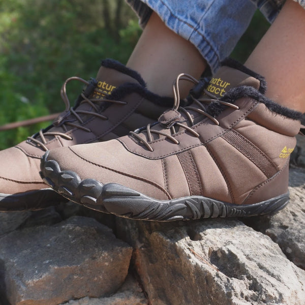 video brown barefoot shoes on the rocks and naturcontact yellow logo