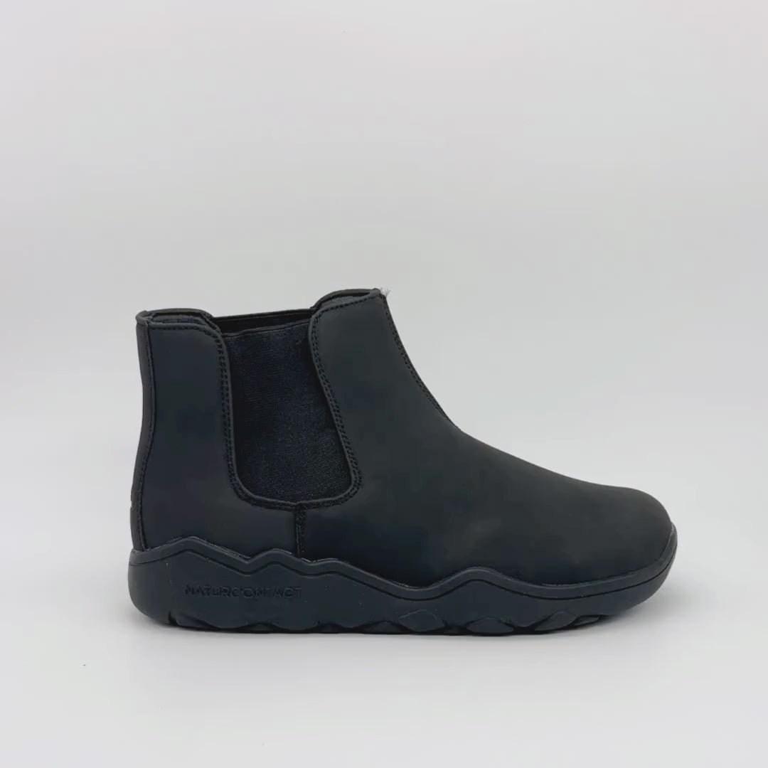 Video of a black Chelsea boot with black sole on a white background