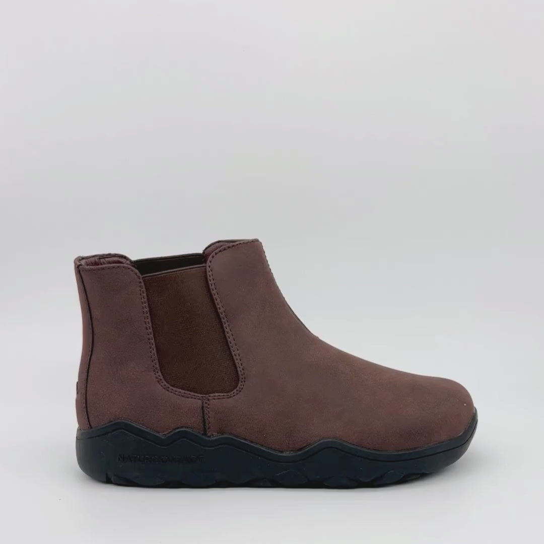 Video of a Brown Chelsea boot with black sole on a white background