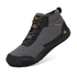 A mid-cut waterproof hiking boot in gray and black with yellow accents, featuring a soft fleece lining and a rugged sole, shown on a white background.