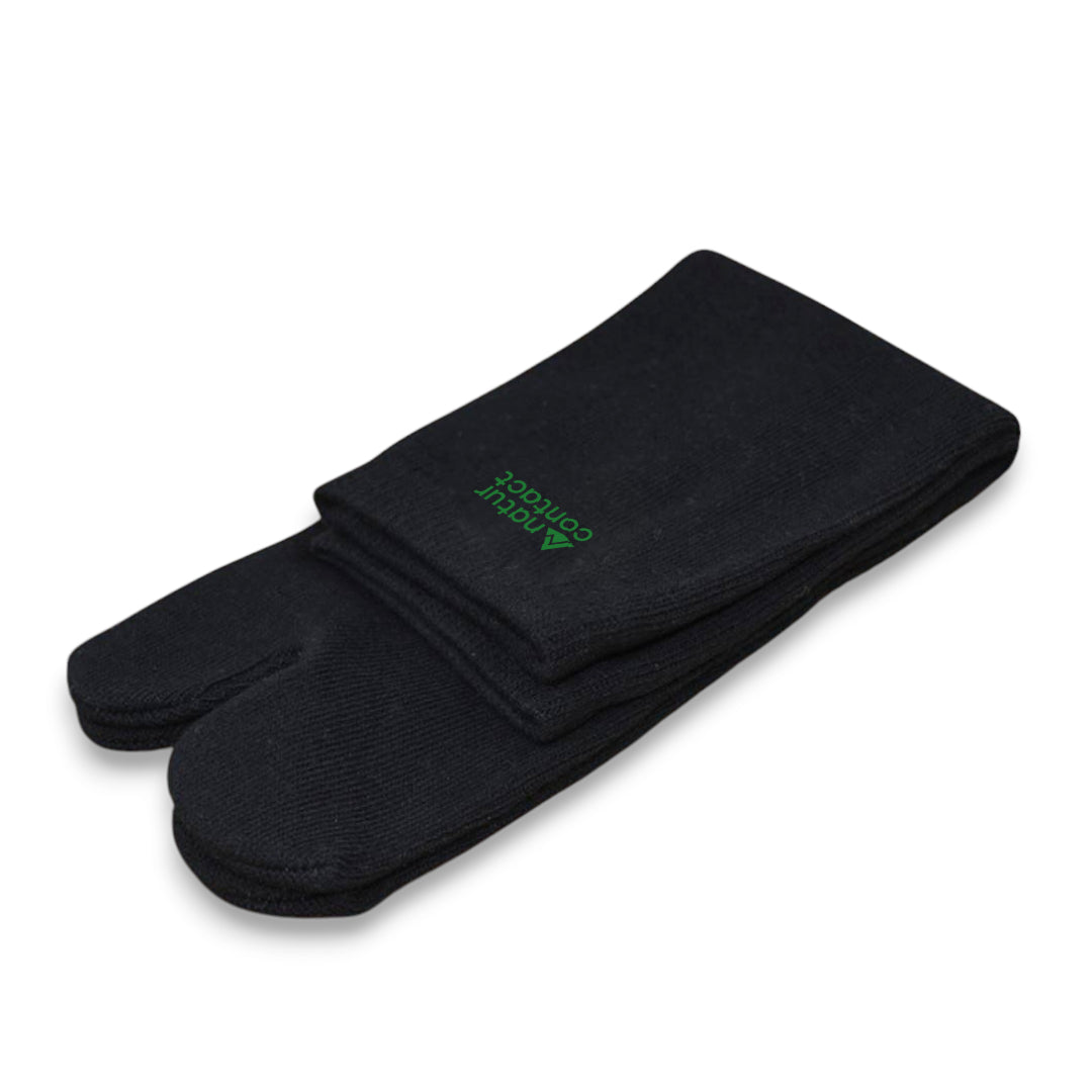 Pair of black socks with a green logo on a white background