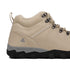 Beige hiking boot with black sole on a white background