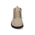 Beige boot with black sole on a white background