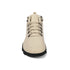 Beige boot with black sole on a white background