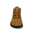 Tan boot with black sole on a white background