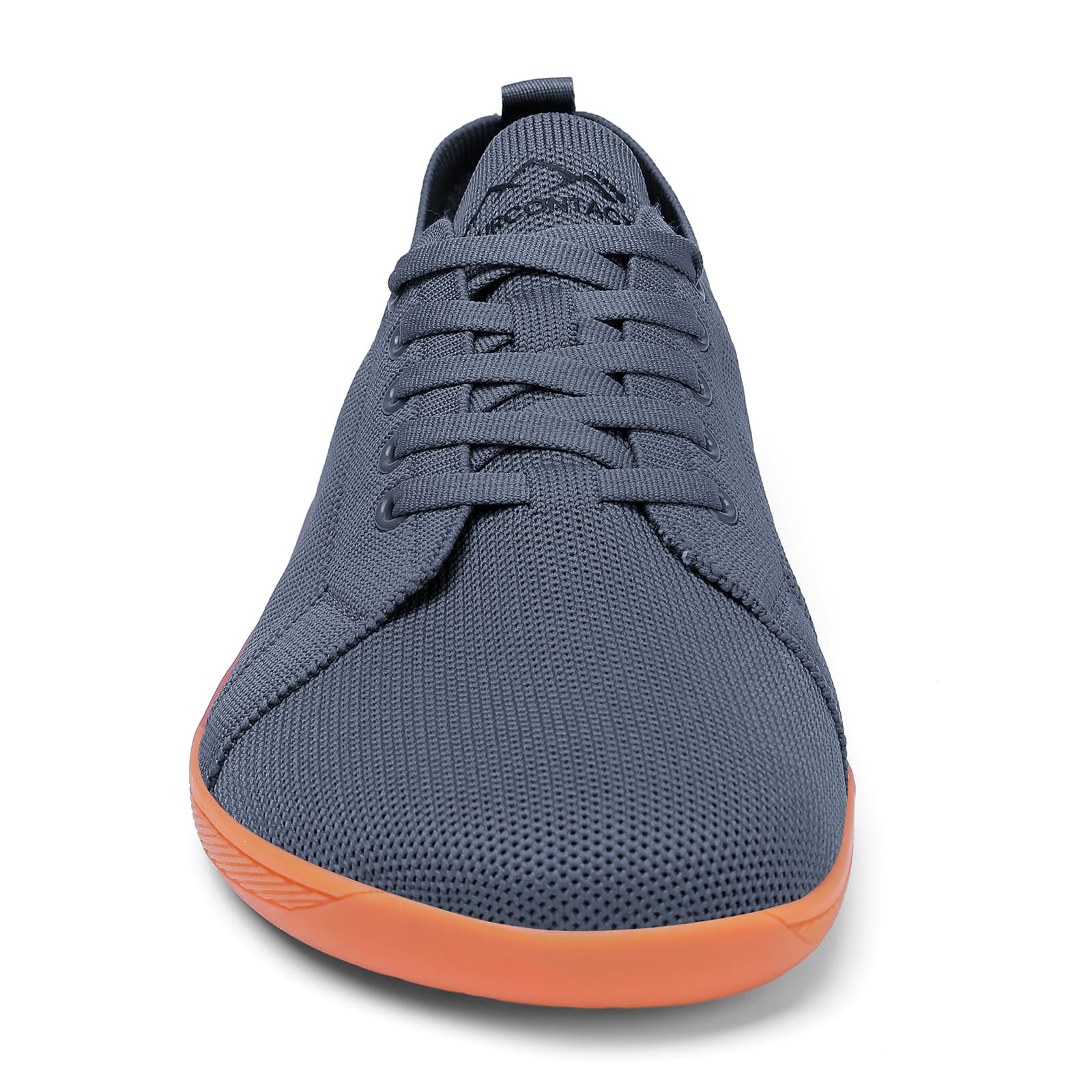 Gray sneaker with orange sole on a white background