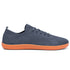 grey sneaker with orange sole on a white background