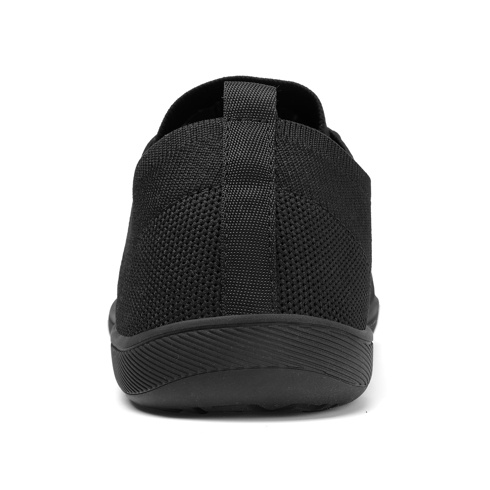 Black slip-on sneaker on a white background