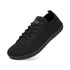 Black sneaker with lace-up design on a white background