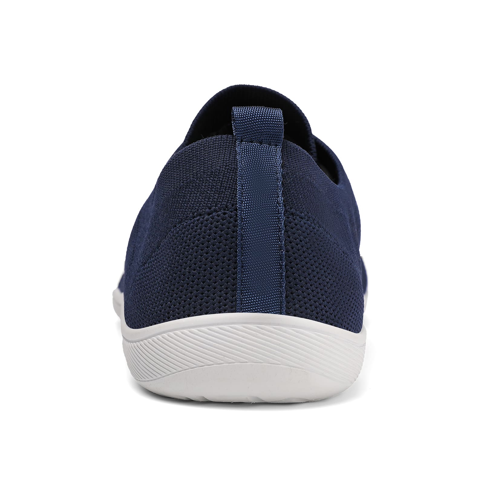 Navy slip-on sneaker with white sole on a white background