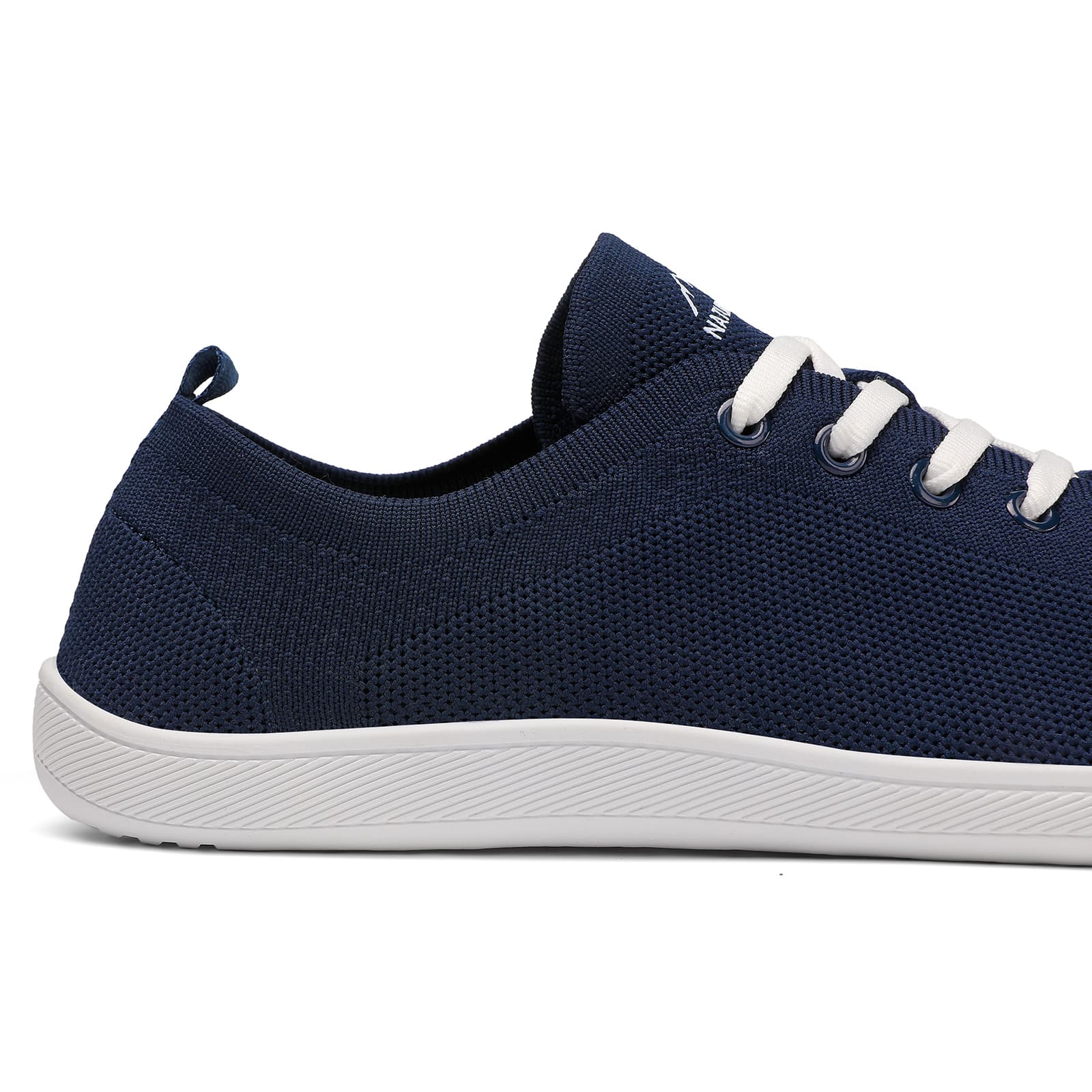 Navy blue sneaker with white laces on a white background