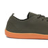 Dark gray sneaker with orange sole on a white background