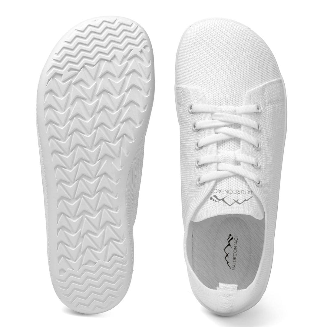 White sneakers with sole and side views on a white background