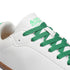 Detail of green laces and tongue branding on Walker Leather barefoot shoes in white