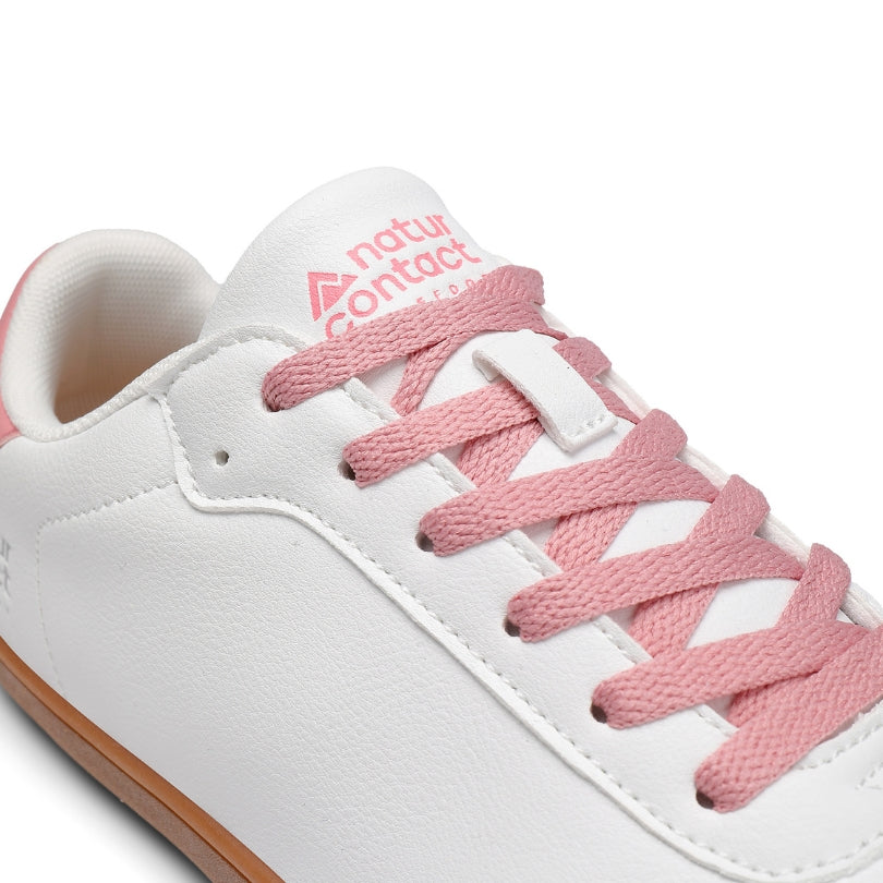 Detail of pink laces and tongue branding on Walker Leather barefoot shoes in white