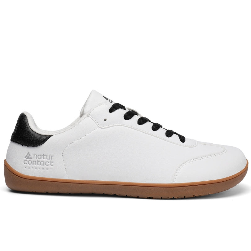 Side view of Walker Leather barefoot shoes in white and black showing slim everyday barefoot profile